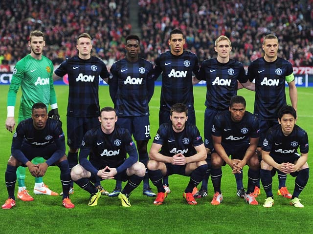 Manchester United players pose for a team photo before kick-off in the Champions League quarter final match against Bayern Munich on April 9, 2014