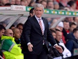 Stoke City's Welsh manager Mark Hughes attends the English Premier League football match between Stoke City and Newcastle United at the Britannia Stadium in Stoke on Trent on April 12, 2014