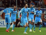 Marseille's French forward Andre-Pierre Gignac celebrateswith teammates after scoring a goal on April 11, 2014 