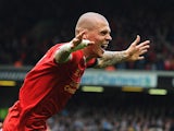 Liverpool's Martin Skrtel celebrates after scoring his team's second goal against Manchester City during the Premier League match on April 13, 2014