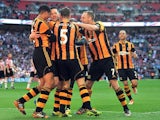 Hull's Matty Fryatt celebrates with team mates after scoring his team's second goal against Sheffield United during the FA Cup semi final match on April 13, 2014