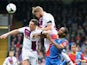 Nathan Baker of Aston Villa out jumps teammate Ciaran Clark and Cameron Jerome of Crystal Palace during the Barclays Premier League match on April 12, 2014