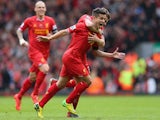 Liverpool's Philippe Coutinho celebrates after scoring his team's third goal against Manchester City during the Premier League match on April 13, 2014