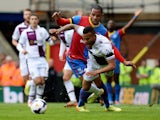 Ryan Bertrand of Aston Villa tangles with Jason Puncheon of Crystal Palace during the Barclays Premier League match on April 12, 2014