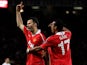 Manchester United's Ryan Giggs celebrates with teammate Nani after scoring his team's first goal against Chelsea during the Champions League quarter final match on April 12, 2011
