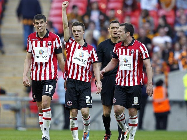 Sheffield United's Stefan Scougall celebrates after scoring his team's second goal against Hull during the FA Cup semi final match on April 13, 2014