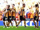 Hull's Stephen Quinn celebrates with team mates after scoring his team's fourth goal against Sheffield United during the FA Cup semi final match on April 13, 2014