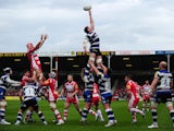 Stuart Hooper of Bath (C) stretches for the line out during the Aviva Premiership match between Gloucester and Bath at Kingsholm Stadium on April 12, 2014