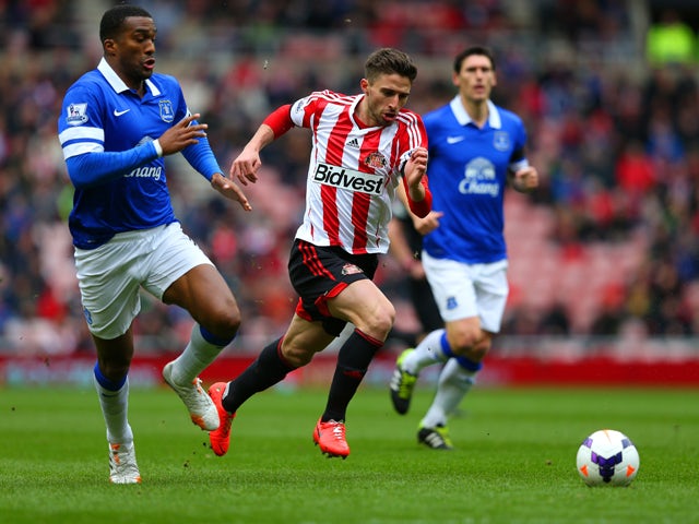 Fabio Borini of Sunderland and Sylvain Distin of Everton compete for the ball during the Barclays Premier League match between Sunderland and Everton at Stadium of Light on April 12, 2014