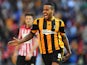 Hull's Tom Huddlestone celebrates after scoring his team's third goal against Sheffield United during the FA Cup semi final match on April 13, 2014
