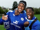 Leicester City players Wes Morgan and Jeffrey Schlupp celebrate their promotion to the Premier League at training on April 7, 2014