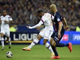 Lyon's French forward Alexandre Lacazette scores a goal against PSG during the French League Cup final football match on April 19, 2014
