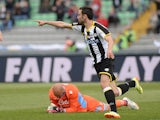 Udinese's Bruno Fernandes celebrates after scoring his team's first goal against Napoli during the Serie A match on April 19, 2014