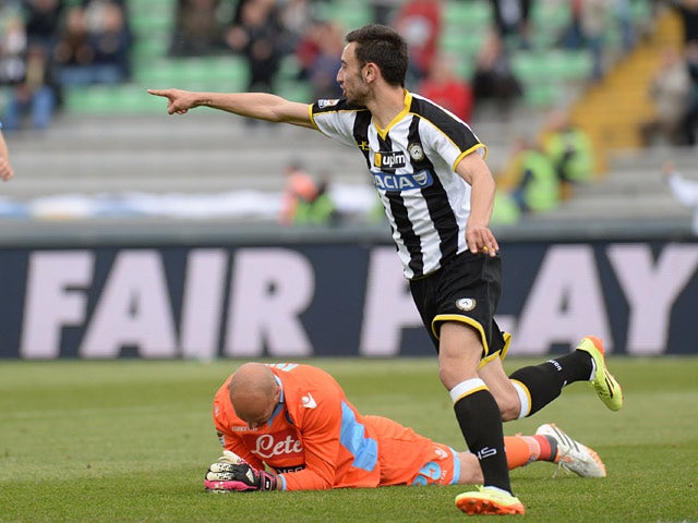 Udinese's Bruno Fernandes celebrates after scoring his team's first goal against Napoli during the Serie A match on April 19, 2014