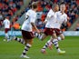 Michael Kightly of Burnley celebrates his goal with team mates during the Sky Bet Championship match between Blackpool and Burnley at Bloomfield Road on April 18, 2014