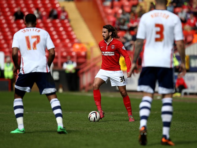 Diego Poyet of Charlton looks to keep play moving during the Sky Bet Championship match between Charlton Athletic and Bolton Wanderers at The Valley on April 18, 2014