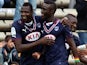 Bordeaux's Malian forward Cheick Diabate (L) celebrates with teammates after scoring a goal during the French L1 football match between FC Girondins de Bordeaux and EA Guinguamp, on April 20, 2014