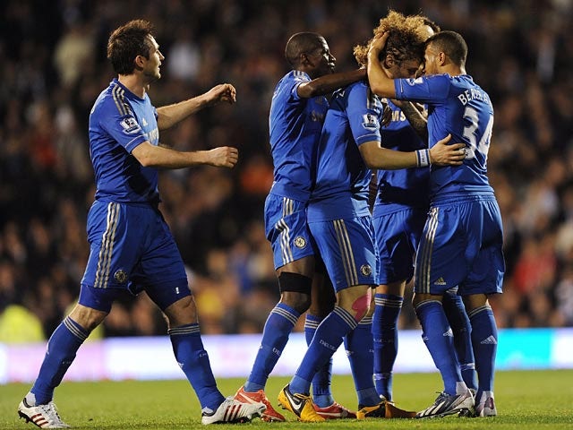 Chelsea's David Luiz celebrates with team mates after scoring the opening goal against Fulham during the Premier League match on April 17, 2013