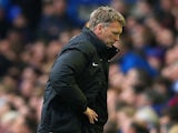 A dejected David Moyes manager of Manchester United looks to the ground during the Barclays Premier League match between Everton and Manchester United on April 20, 2014