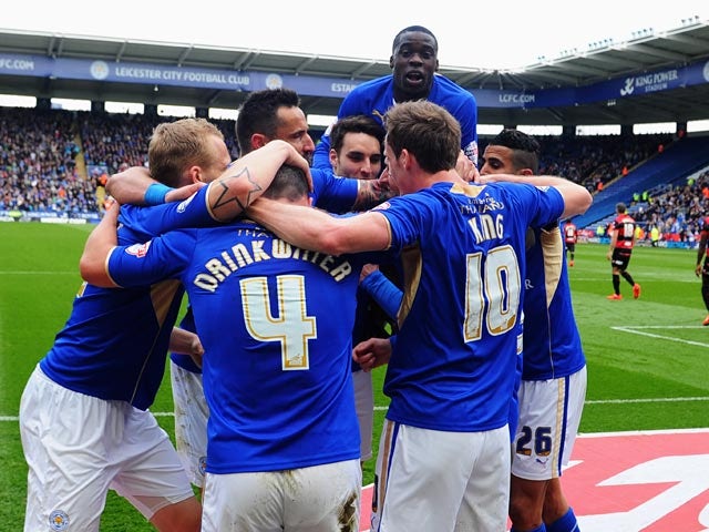 Leicester's David Nugent is congratulated by teammates after scoring the opening goal against QPR during their Championship match on April 19, 2014