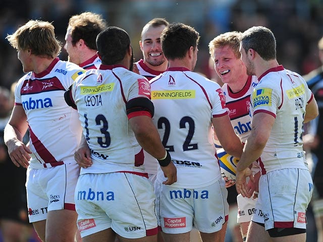 Sale Sharks' David Seymour is congratulated by teammates after scoring his side's 6th try against Exeter Chiefs during the Aviva Premiership match on April 19, 2014