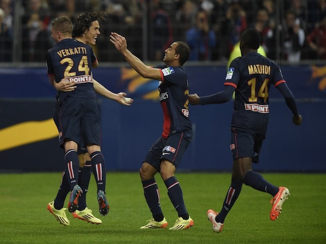 Paris' Uruguayan forward Edinson Cavani (2nd R) celebrates with teammates after a goal against Lyon on April 19, 2014