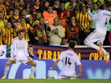 Gareth Bale of Real Madrid reacts after scoring Real's 2nd goal during the opa del Rey Final between Real Madrid and Barcelona at Estadio Mestalla on April 16, 2014