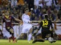 Real Madrid's Welsh forward Gareth Bale (C) scores during the Spanish Copa del Rey (King's Cup) final 'Clasico' football match against FC Barcelona on April 16, 2014
