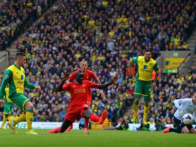 Norwich's Gary Hooper scores his team's first goal against Liverpool during the Premier League match on April 20, 2014