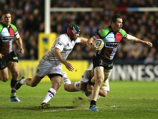 Tim Molenaar of Harlequins is held by Neil Briggs and Julian Salvi (L) during the Aviva Premiership match between Harlequins and Leicester Tigers at the Twickenham Stoop on April 18, 2014