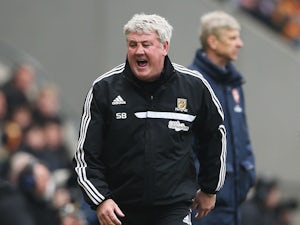 Hull City manager Steve Bruce reacts on the touchline during the Barclays Premier League match between Hull City and Arsenal at KC Stadium on April 20, 2014