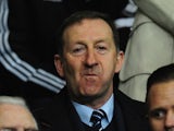Swansea chairman Huw Jenkins (c) looks on before the UEFA Europa League Round of 32 first leg between Swansea City and SSC Napoli at Liberty Stadium on February 20, 2014