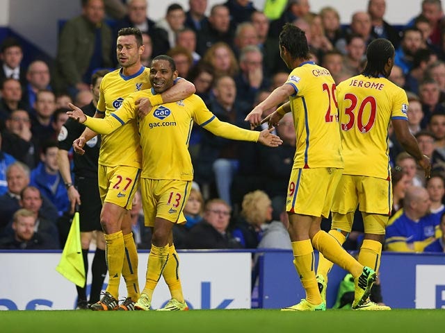 Crystal Palace's Jason Puncheon celebrates with team mates after scoring the opening goal against Everton during the Premier League match on April 16, 2014