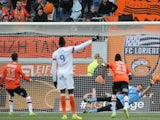 Lorient French forward Jeremie Aliadiere (L) scores a penalty kick during the French L1 football match Lorient vs Montpellier on April 20, 2014