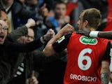 Rennes' Polish forward Kamil Grosicki celebrates after scoring a goal during the French cup semifinal football match between Rennes and Angers on April 15, 2014
