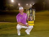 Lee Westwood poses with the trophy after winning the final round at the Maybank Malaysian Open on April 19, 2014