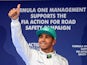 Lewis Hamilton of Mercedes celebrates after qualifying in pole position for the F1 Chinese Grand Prix on April 19, 2014