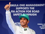 Lewis Hamilton of Mercedes celebrates after qualifying in pole position for the F1 Chinese Grand Prix on April 19, 2014
