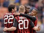 AC Milan's Mario Balotelli celebrates with teammates after scoring the opening goal against Livorno during the Serie A match on April 19, 2014