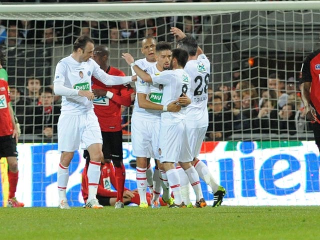 Monaco players celebrate after scoring against Guingamp during the French Cup semi-final match on April 16, 2014