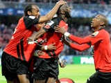 Guingamp's Mustapha Yatabare celebrates with team mates after scoring the opening goal against Monaco during the French Cup semi-final match on April 16, 2014