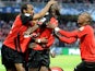 Guingamp's Mustapha Yatabare celebrates with team mates after scoring the opening goal against Monaco during the French Cup semi-final match on April 16, 2014