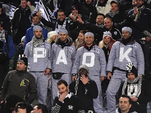 PAOK FC fans show their support during the UEFA Europa League Round of 32 first leg match between Udinese Calcio and PAOK FC at Friuli Stadium on February 16, 2012