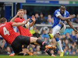 Manchester United's English defender Phil Jones (Far L) handles the ball off a shot from Everton's Belgian striker Romelu Lukaku (R) which results in a penalty during the match on April 20, 2014