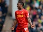 Liverpool's Raheen Sterling celebrates after scoring the opening goal against Norwich during the Premier League match on April 20, 2014