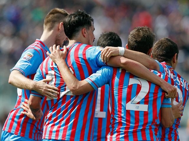 Catania's Sebastian Leto celebrates with teammates after scoring the opening goal against Sampdoria during the Serie A match on April 19, 2014