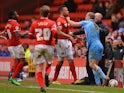 Stephen Dawson of Barnsley clashes with Jordan Cousins of Charlton on the touchline during the Sky Bet Championship match on April 15, 2014