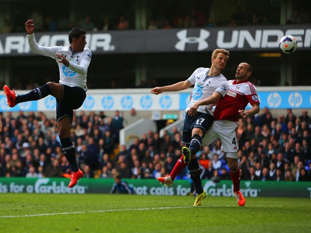 Harry Kane of Tottenham Hotspur scores their second goal during the Barclays Premier League match between Tottenham Hotspur and Fulham at White Hart Lane on April 19, 2014