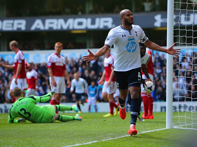 Younes Kaboul of Tottenham Hotspur celebrates scoring their third goal during the Barclays Premier League match between Tottenham Hotspur and Fulham at White Hart Lane on April 19, 2014