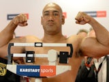 Australian boxer Alex Leapai gestures during the official weigh-in on April 25, 2014